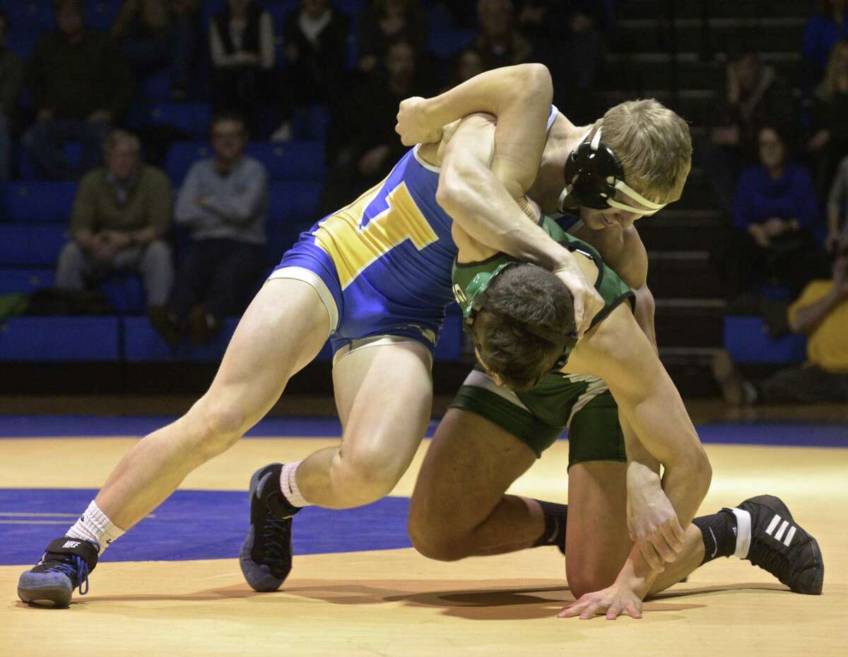 New Milford's Alex Richards and Newtown's Ed lovely wrestle in the 152 lb weight class during the SWC high school wrestling match between New Milford and Newtown high schools on Wednesday night, January 11, 2017, at Newtown High School, in Newtown, Conn.
