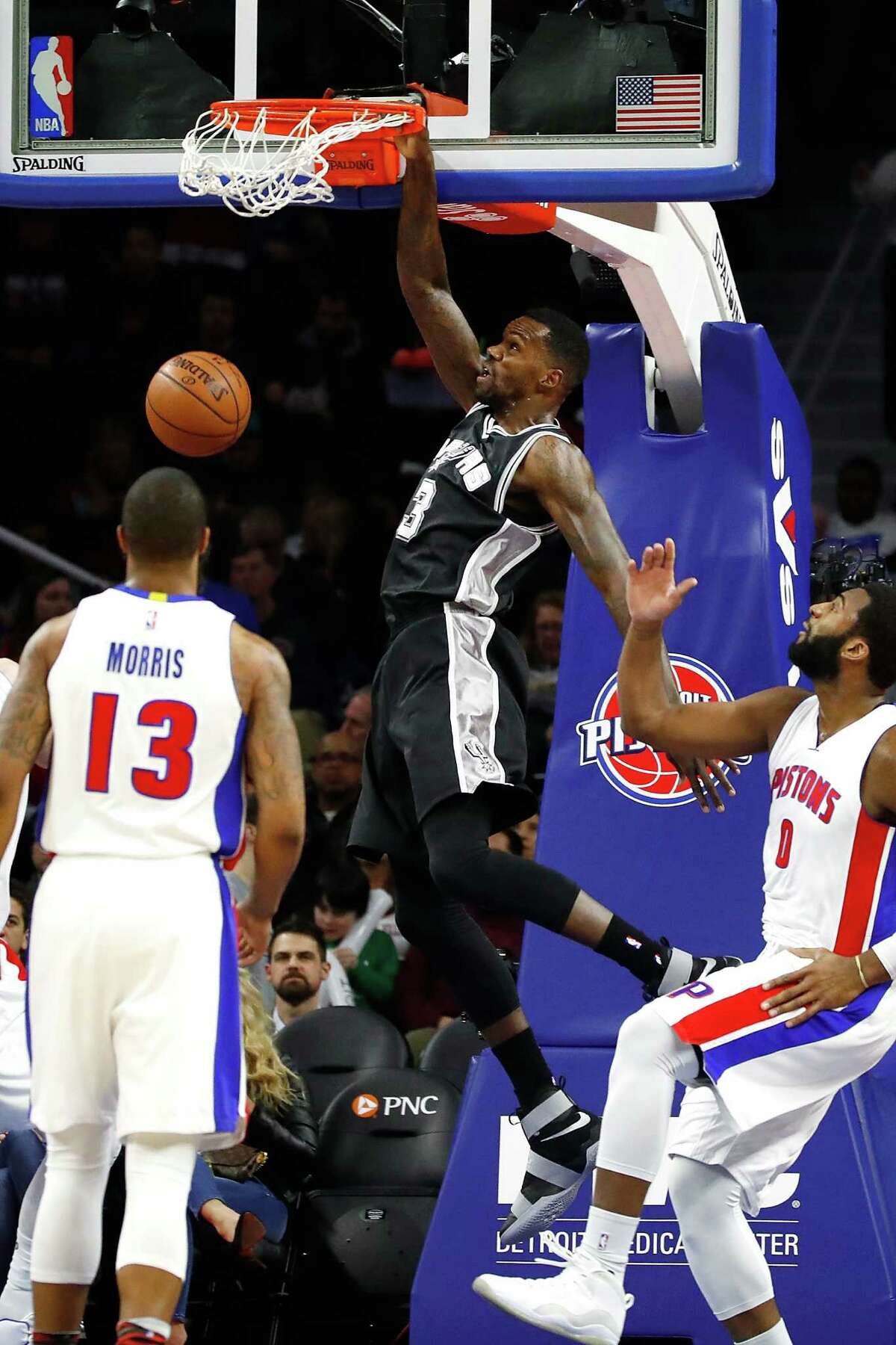 AUBURN HILLS, MI - FEBRUARY 10: Dewayne Dedmon #3 of the San Antonio Spurs gets a first half dunk between Marcus Morris #13 an Andre Drummond #0 of the Detroit Pistons at the Palace of Auburn Hills on February 10, 2017 in Auburn Hills, Michigan. San Antonio won the game 103-92. NOTE TO USER: User expressly acknowledges and agrees that, by downloading and or using this photograph, User is consenting to the terms and conditions of the Getty Images License Agreement.