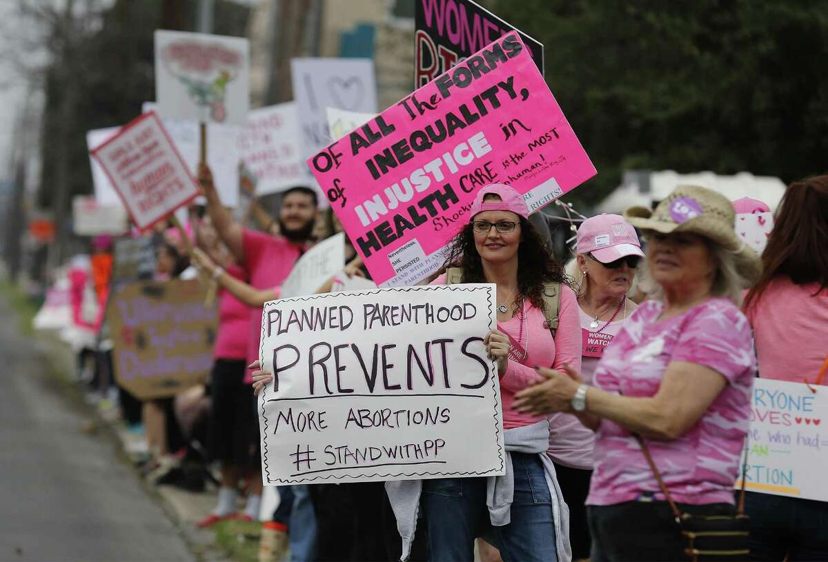 Supporters of Planned Parenthood line a sidewalk along West Commerce Street. No counterdemonstrators were at the rally on Saturday, though a small anti-Planned Parenthood protest was planned for a clinic on the Northwest Side.