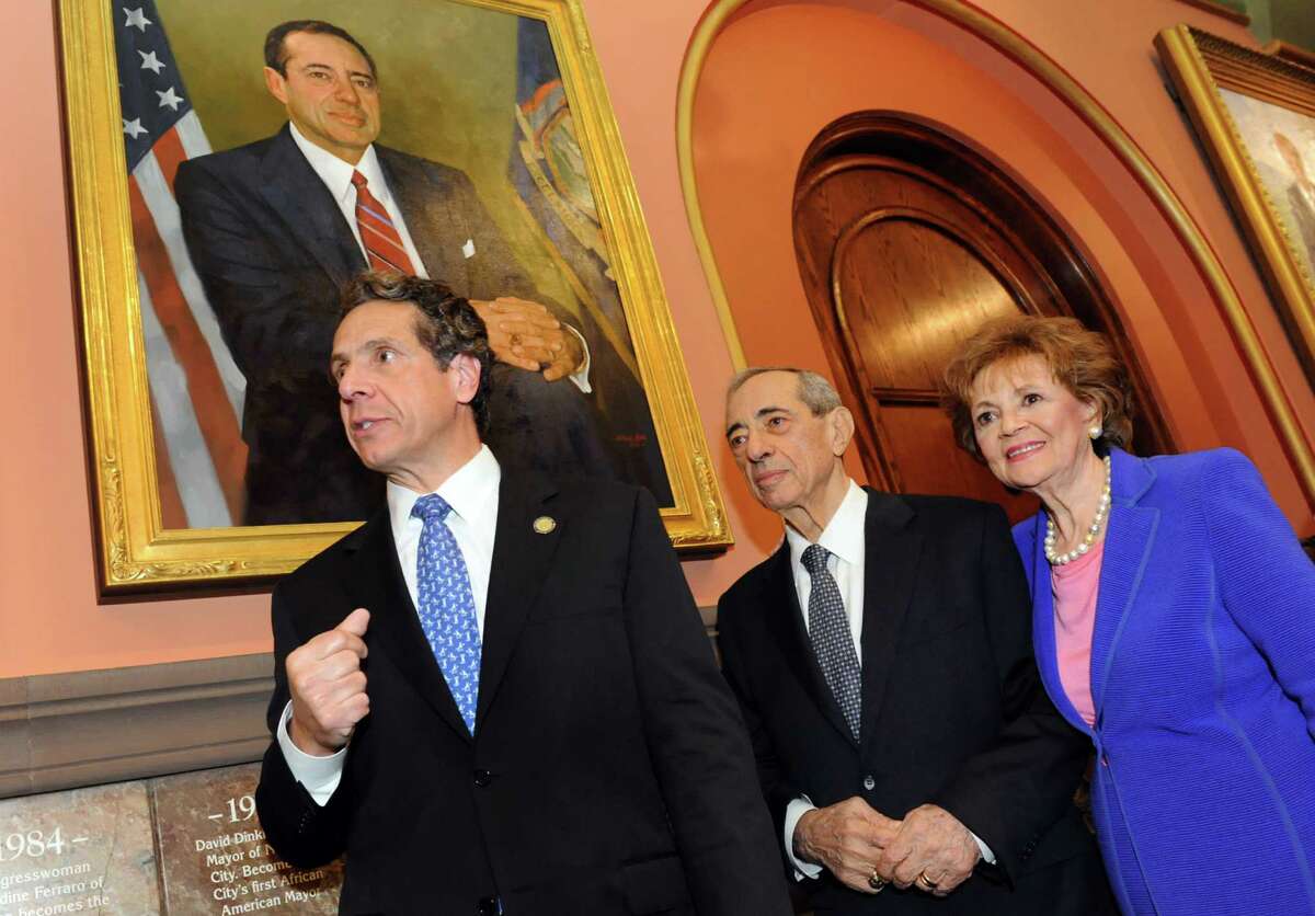 Gov. Andrew Cuomo joins his father, former Gov. Mario Cuomo, and mother, former First Lady Matilda Cuomo, as the elder Cuomo's portrait is revealed in the Hall of Governors on Saturday, June 15, 2013, at the Capitol in Albany, N.Y. (Cindy Schultz / Times Union)