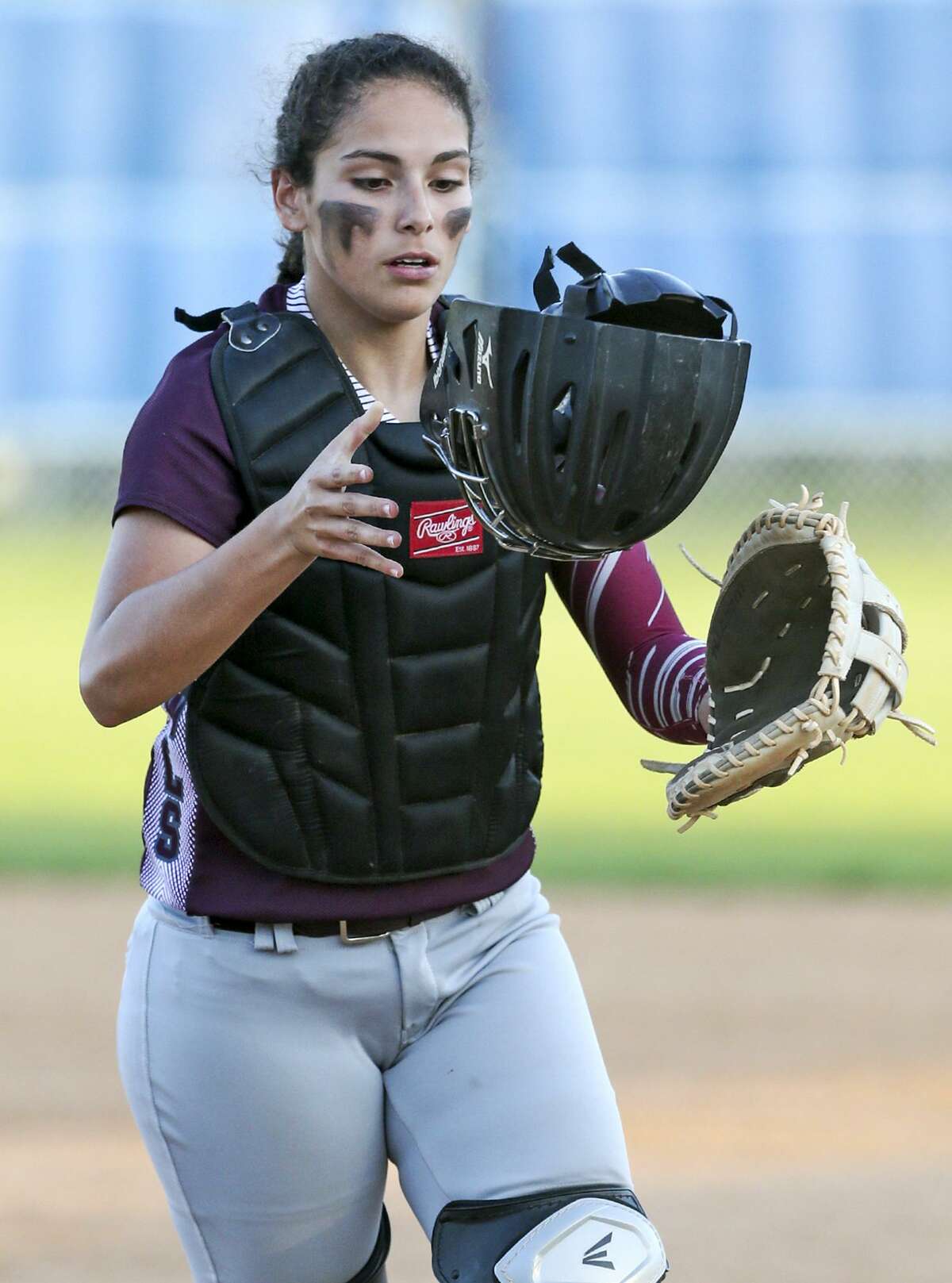 Highlands catcher Alyssa Flores comes off the field during a District 28-5A game with Brackenridge at the Mary Ann Villarreal Sports Complex on March 22, 2016.