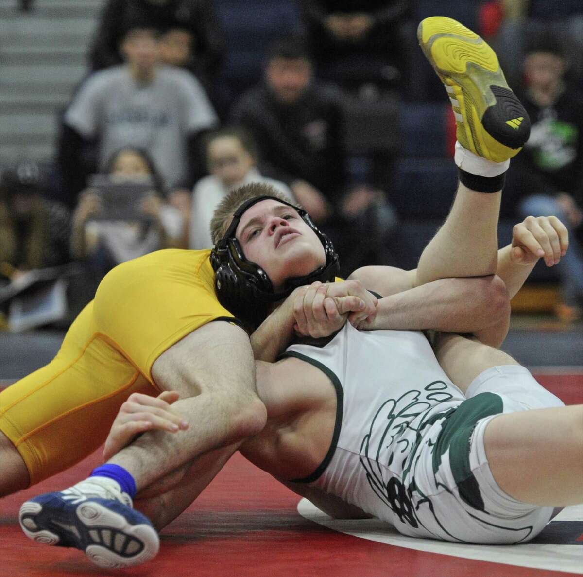 New Milford's Tyler Schultz and Newtown's Aaron Occhipinti wrestle for the 132 pound weight class SWC wrestling championship on Saturday, February 11, 2017, at New Fairfield High School, in New Fairfield, Conn.