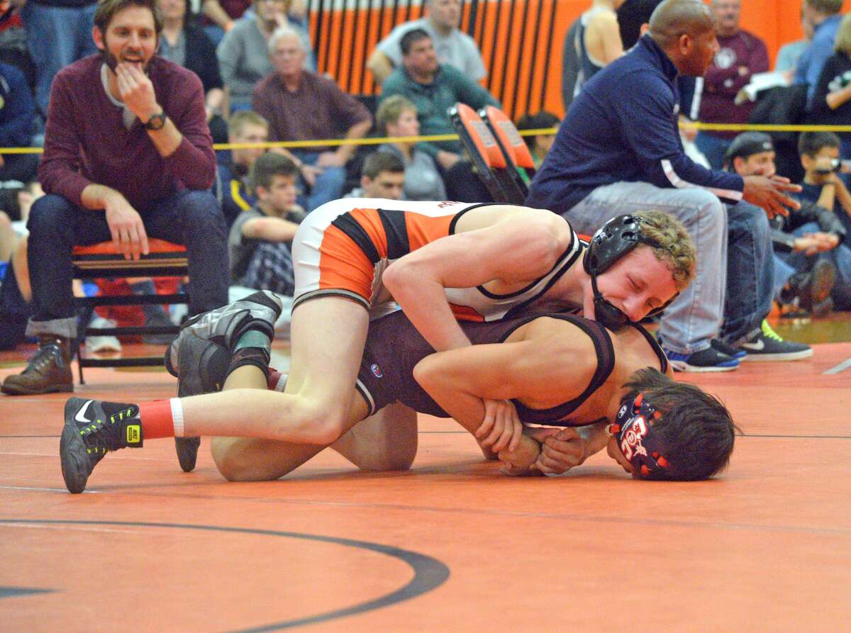 Edwardsville freshman Luke Odom wrestles Matt Ramos of Lockport on Saturday in the 106-pound championship match at the Class 3A Normal Community Sectional.