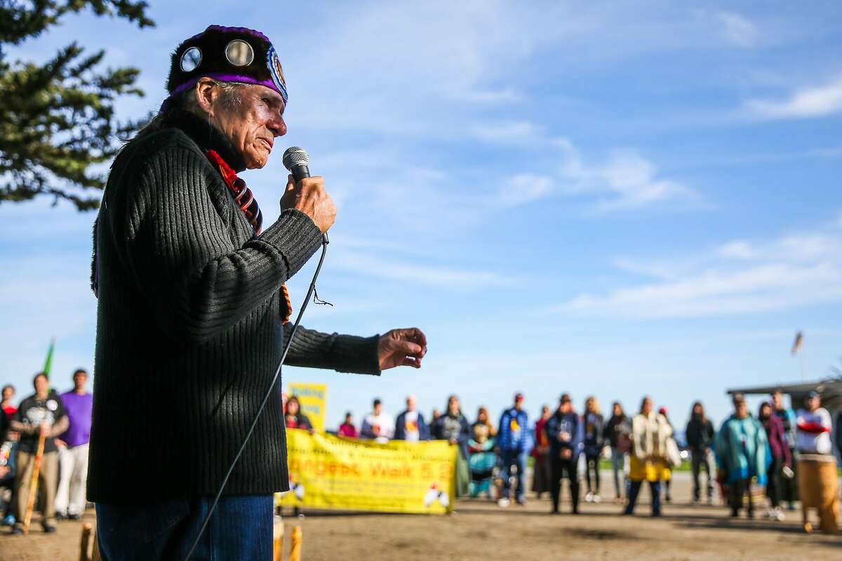 Founder of "the longest walk", Dennis Banks (center), speaks during the kickoff of the walk at Crissy Field in San Francisco, California, on Sunday, Feb. 12, 2017. The walk, which goes from San Francisco to Washington D.C. is part of a project to end the drug and alcohol use on reservations.