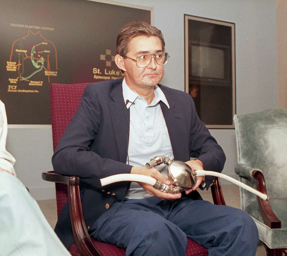10/01/1991 - Heart patient Mike Templeton shows the ventricular assist device that was implanted in his body 28 days ago. Templeton is only the second recipient of the portable, battery-assisted pump and is the first one who appears to have regained anything close to normal mobility. The first patient was Larry Heinsohn, who died two weeks after his implantation on May 9.