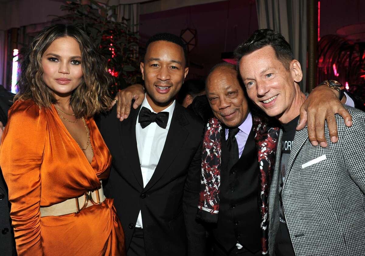 Celebs celebrate Grammy victories during after parties throughout Los Angeles (L-R) Singer-songwriter John Legend, producer Quincy Jones, model Chrissy Teigan, and GQ editor-in-chief Jim Nelson attend GQ and Chance The Rapper Celebrate the Grammys in Partnership with YouTube at Chateau Marmont on February 12, 2017 in Los Angeles, California.