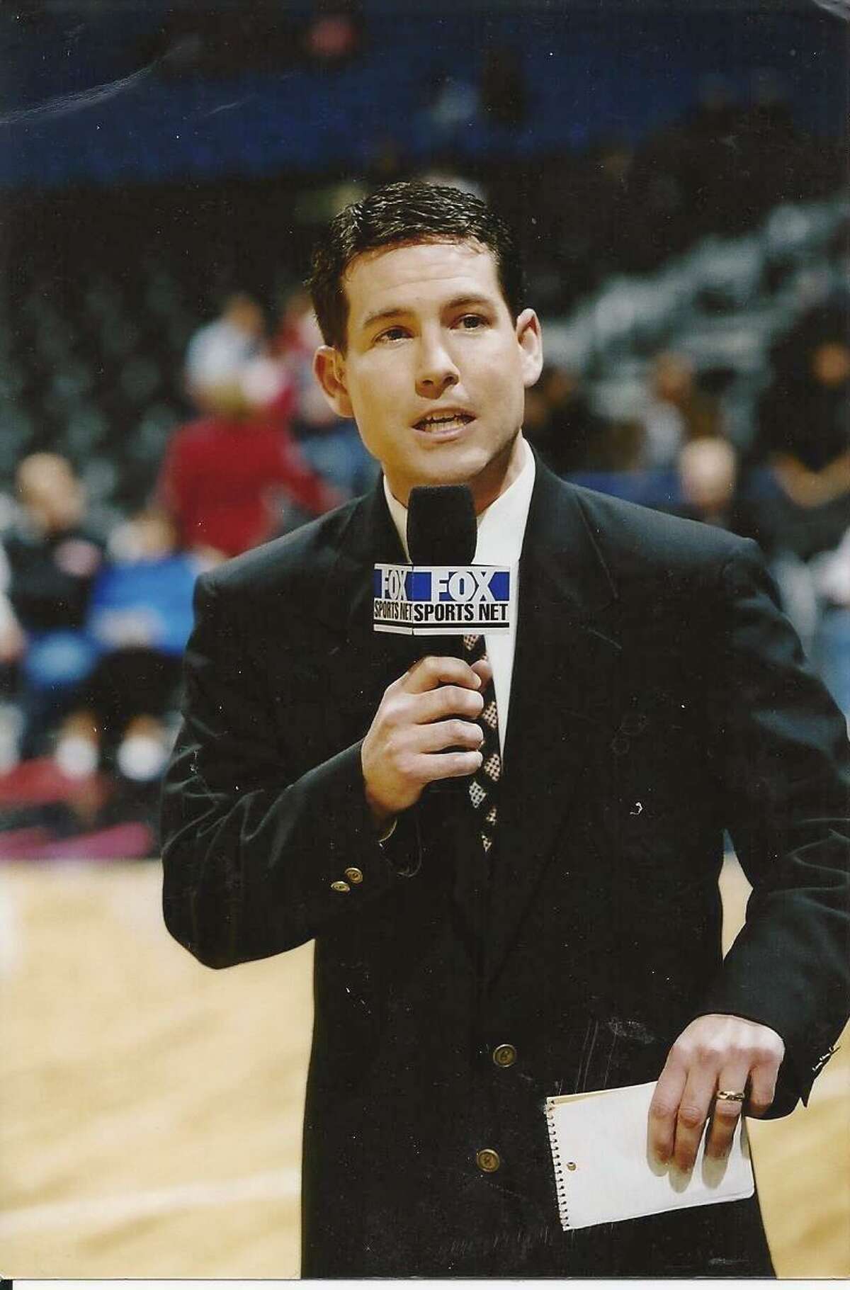 Brian Anderson works as a sideline reporter during a Spurs game for Fox Sports Southwest in 1999.