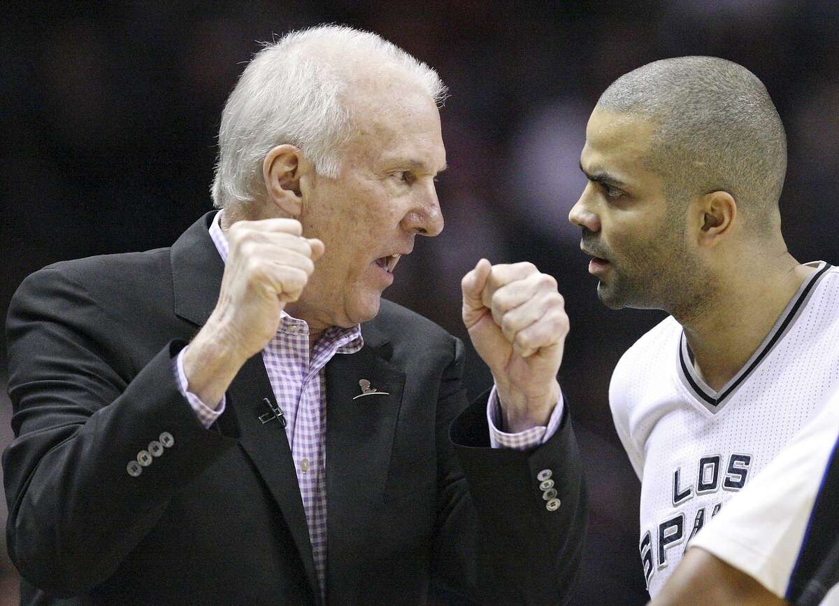 Gregg Popovich talks stratedy with his longtime Spurs point guard, Tony Parker, during a 2014 game at the AT&T Center.