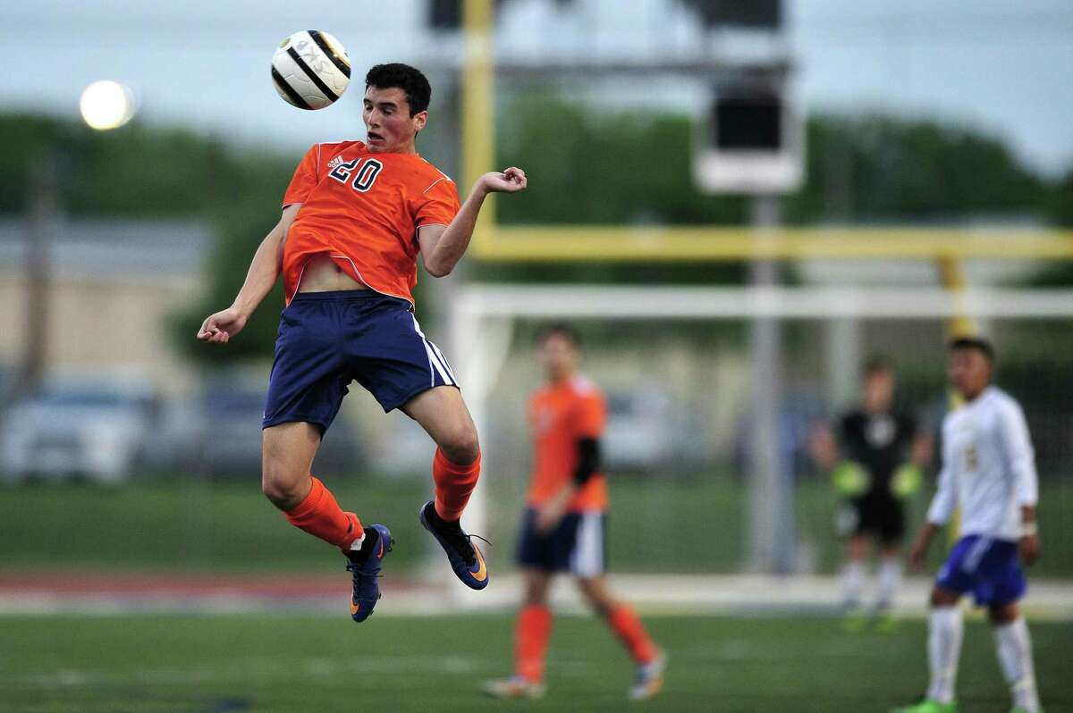 Brandeis's Marlon Flores controls the ball in the air during the Class 6A third-round boys playoff game between Brandeis and Clemens at Clemens High School on Tuesday, April 7, 2015 in San Antonio. Brandeis won the game 4 - 0.