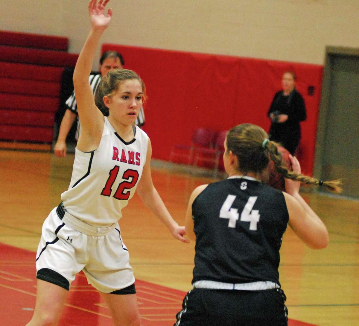 New Canaan's Leigh Charlton defends during a game against Staples on Monday.