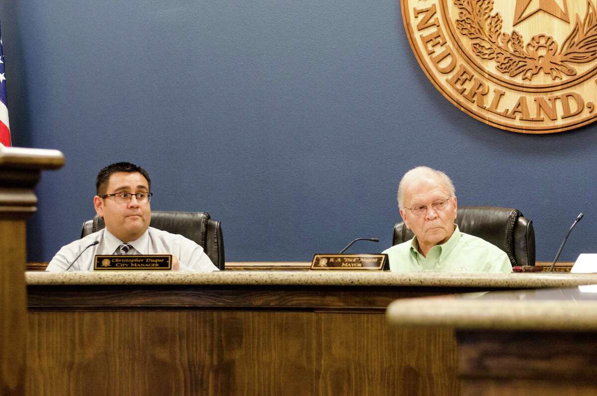 Nederland MayorÂ RA 'Dick' Nugent and City Manager Chrsitopher Duque discuss two project options concerning the reconstruction of Nederland Avenue in a Monday city council meeting. Photo taken Monday, February 13, 2017 Sara E. Flores/The Enterprise