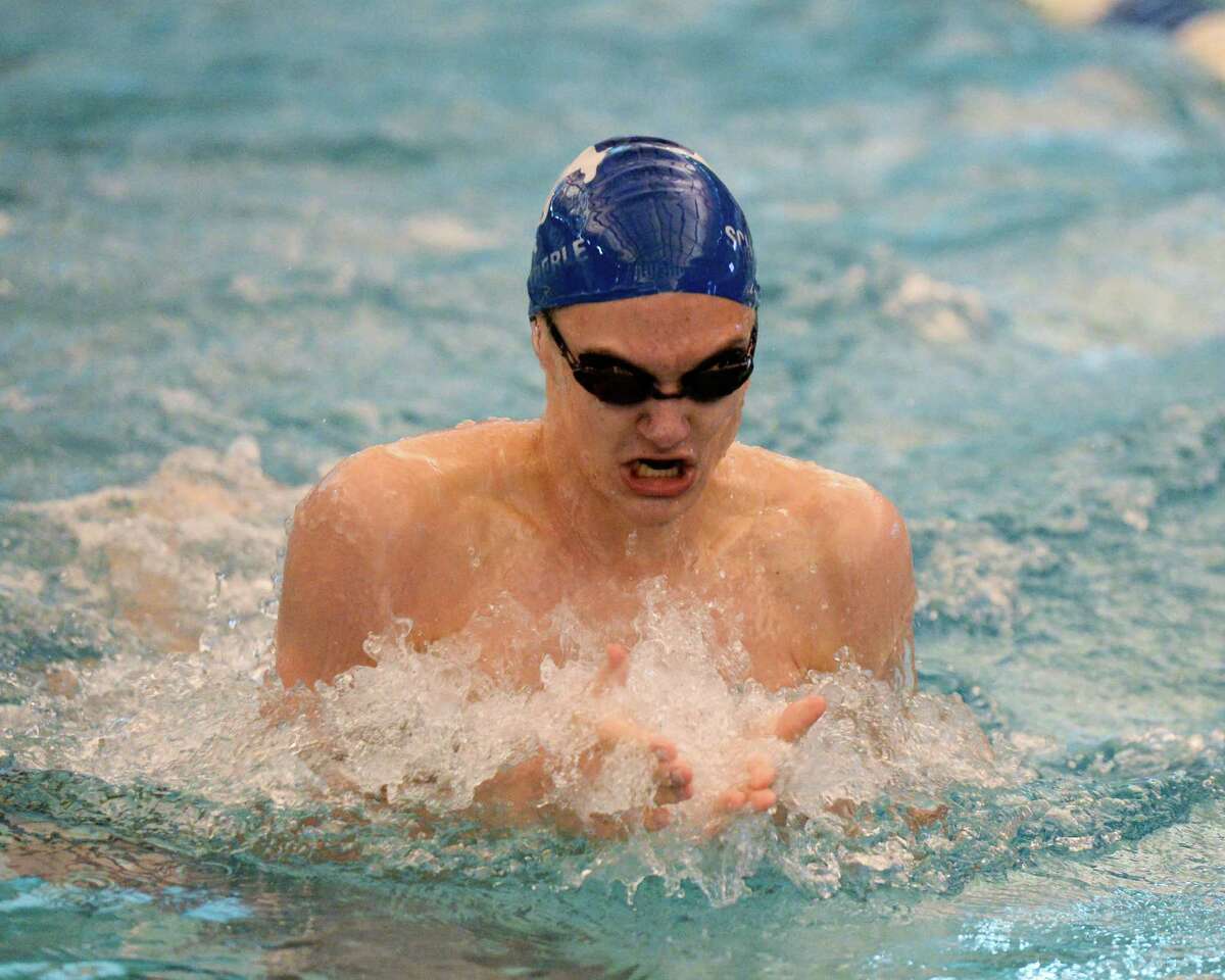 Jacob Schababerle of Taylor High School swims to a first-place finish in the boys 100 yard breastroke.﻿