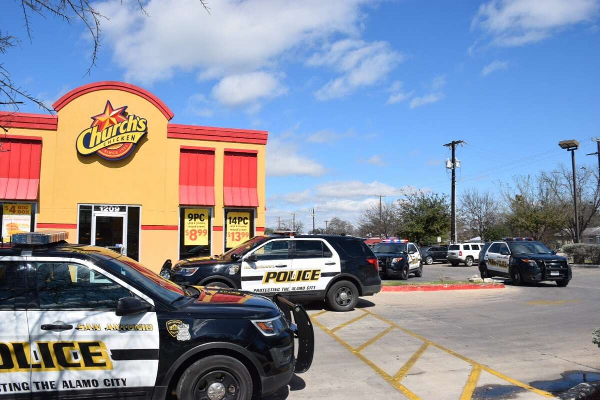 San Antonio police investigate a robbery at the Church's Chicken in the 1200 block of Steves Avenue on Tuesday, Feb. 14, 2017. Officials said the robbers match the description of two suspects who robbed a separate Church's Chicken on Thursday, Feb. 9, 2017.