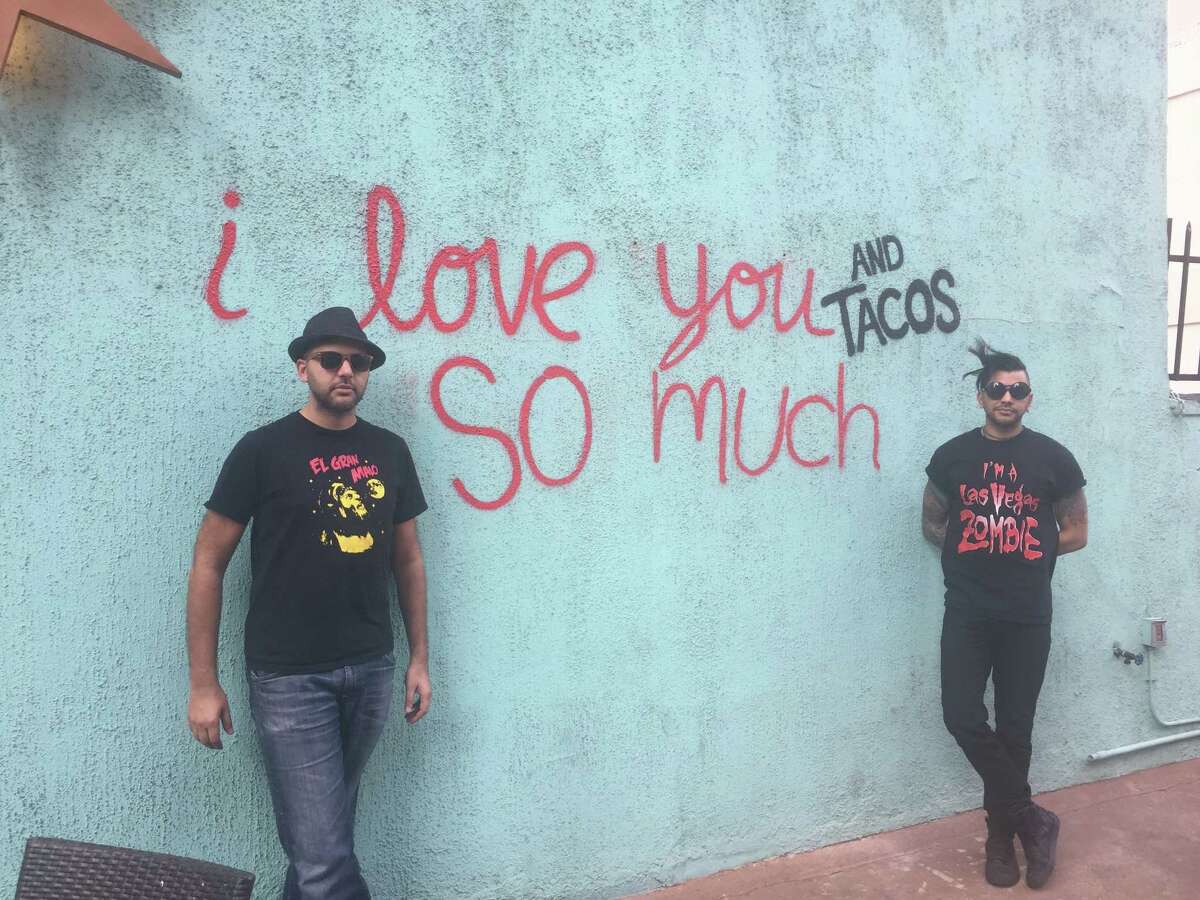 El Big Bad in downtown Houston pays homage to the "I love you so much" wall in Austin and also San Antonio's reinvented "I love tacos so much" recreation with its own tribute. Shown: the wall at El Big Bad with restaurant owner Steve Sharma and his brother Shaun Sharma.