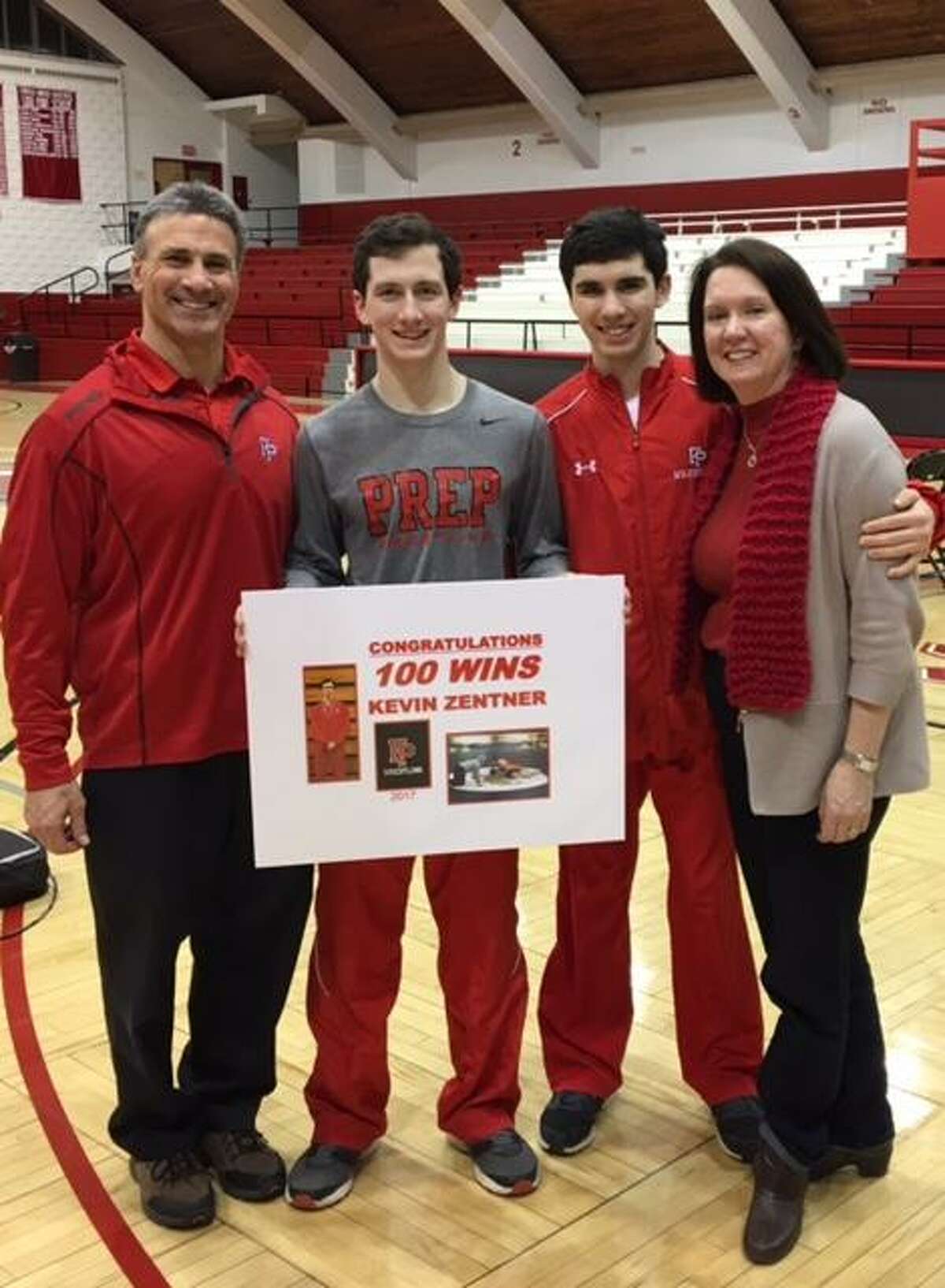 Fairfield Prep’s Kevin Zentner celebrates his 100th career victory during a meet against Law on February 2.