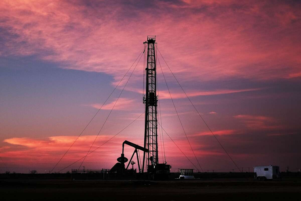 MIDLAND, TX - FEBRUARY 05: An oil drill is viewed near a construction site for homes and office buildings on February 5, 2015 in Midland, Texas. As crude oil prices have fallen nearly 60 percent globally, American communities dependent on oil revenue prepare for hard times. Texas, which benefited from hydraulic fracturing and the shale drilling revolution, tripled its production of oil in the last five years. The Texan economy saw hundreds of billions of dollars come into the state before the global plunge in prices. Across the state drilling budgets are being slashed and companies are notifying workers of upcoming layoffs. According to federal labor statistics, around 300,000 people work in the Texas oil and gas industry, 50 percent more than four years ago. (Photo by Spencer Platt/Getty Images)