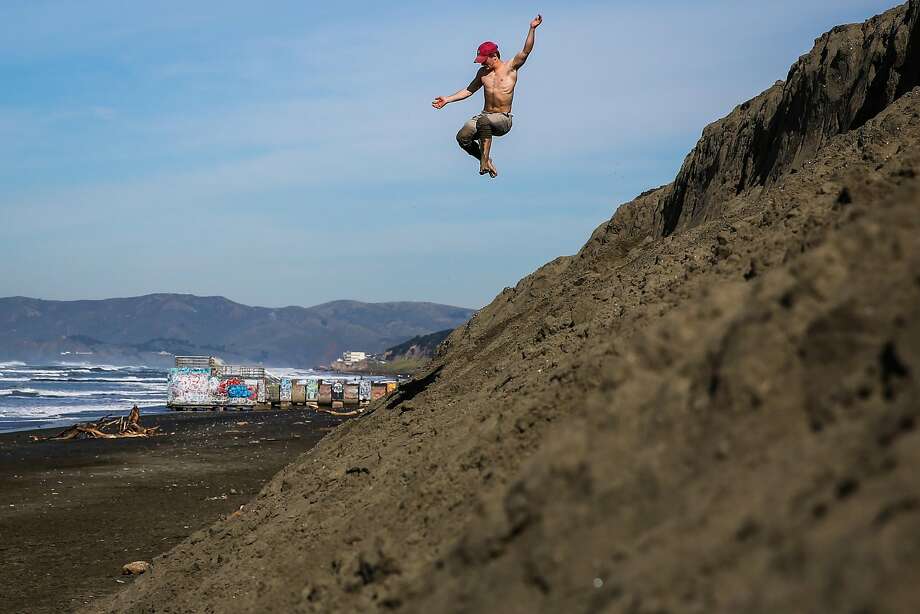 Worst Erosion In 150 Years Tears 180 Feet From Sf S Ocean Beach Sfgate Maurice Green Jumps Off Of A Small Bluff At Ocean Beach In San Francisco California