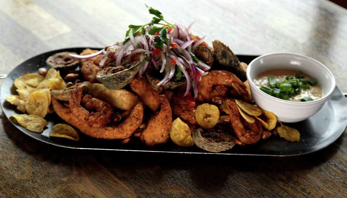 Andes Cafe is among the Houston restaurants participating in the Houston Chronicle's 2017 Culinary Stars dining event on Sept. 14. Shown: The Super Jalea Platter, crispy fresh fried seafood mix, side of yucca sticks, rocto tartar sauce, "salsa crilla" (red onions, lime, aji limo, cliantro) and canchita at Andes Cafe.