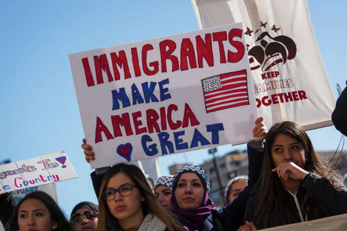 MILWAUKEE, WI - FEBRUARY 13: Protestors gather at the Milwaukee County Courthouse where they attend a rally against President Donald Trumps policy on immigration February 13, 2017 in Milwaukee, Wisconsin. As well groups are calling for a general strike against controversial Milwaukee County Sheriff David Clarke who plans to turn sheriffs into immigration agents.