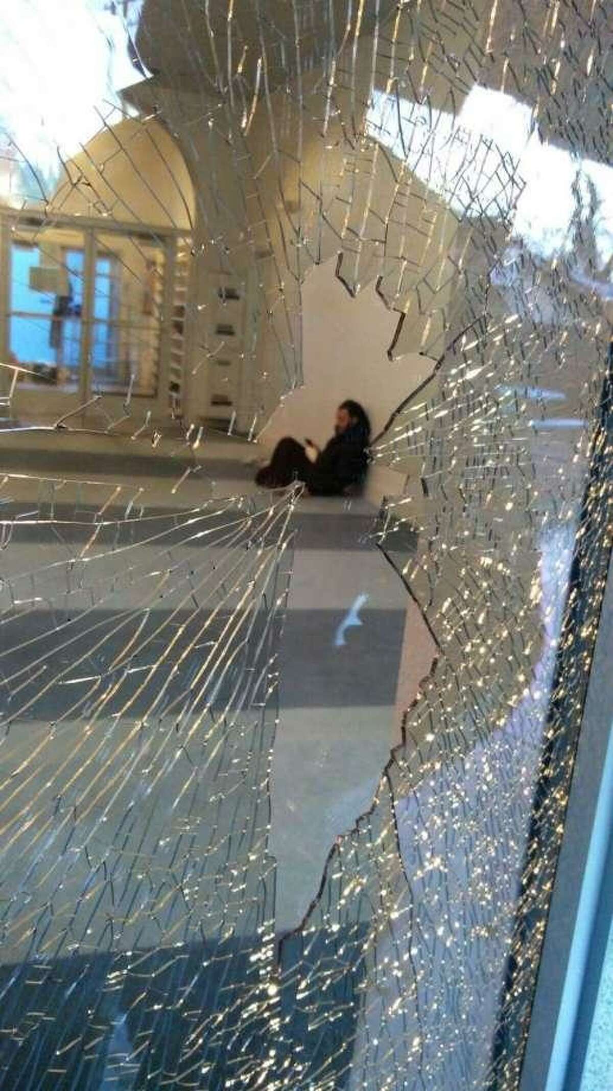 A shattered window seen at the Islamic Center of Davis in January. The suspected vandal, who faces hate crime charges, was identified as 30-year-old Davis resident Lauren Kirk-Coehlo, police said.