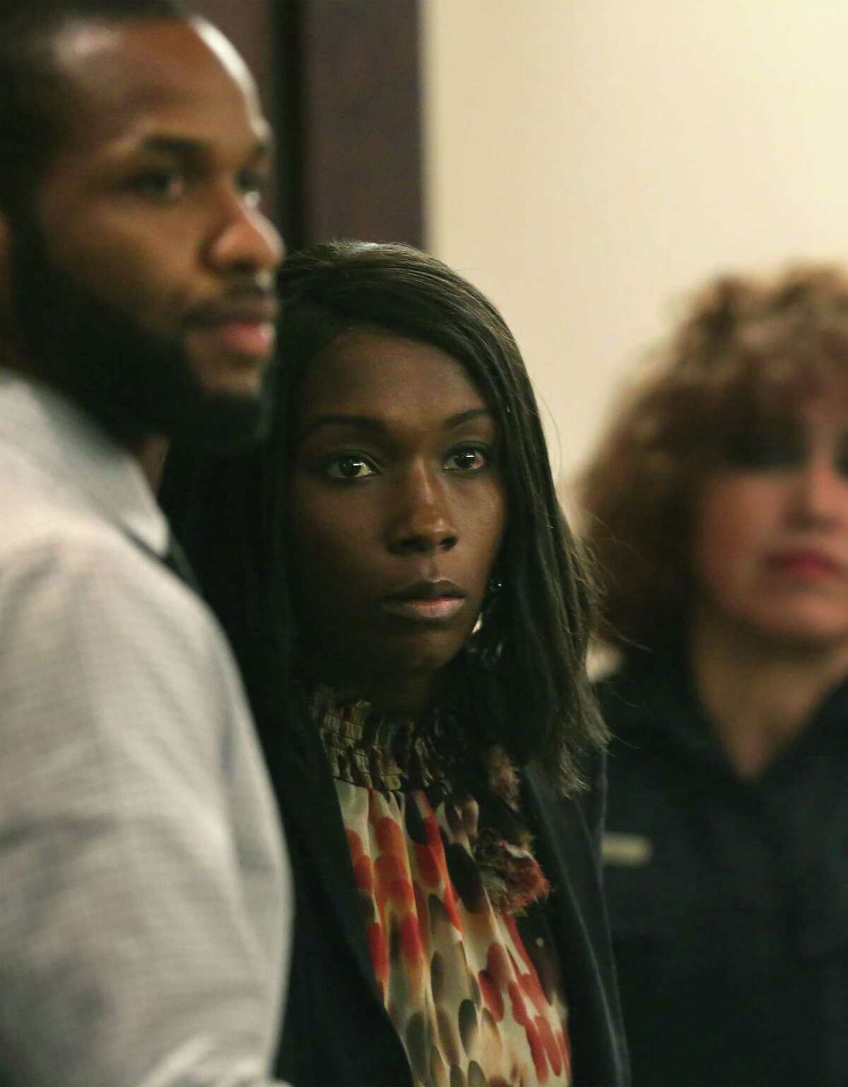 Marquita Johnson, center, and husband Qwalion Busby, left, charged with injury to a child by omission in regard to their son, who died after a severe infection in 2015 appear in the Cadena-Reeves Justice Center, on Tuesday, Feb. 14, 2017. They were found guilty.