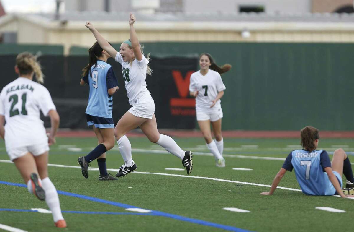 Reagan’s Taylor Olson celebrates her goal in first half during the District 26-6A high school soccer game against Johnson on Feb. 14, 2017.