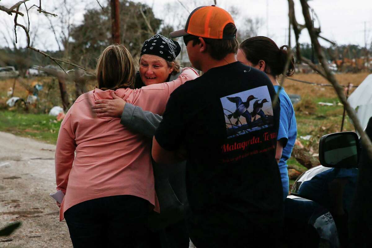 Carrie Casey, left, hugs her friend, Sally Farley, after Farley's home was destroyed by a tornado early Tuesday, Feb. 14, 2017 in Van Vleck. Farley's boyfriend was in the home when the tornado hit and her suffered a fractured wrist when the roof fell on him.