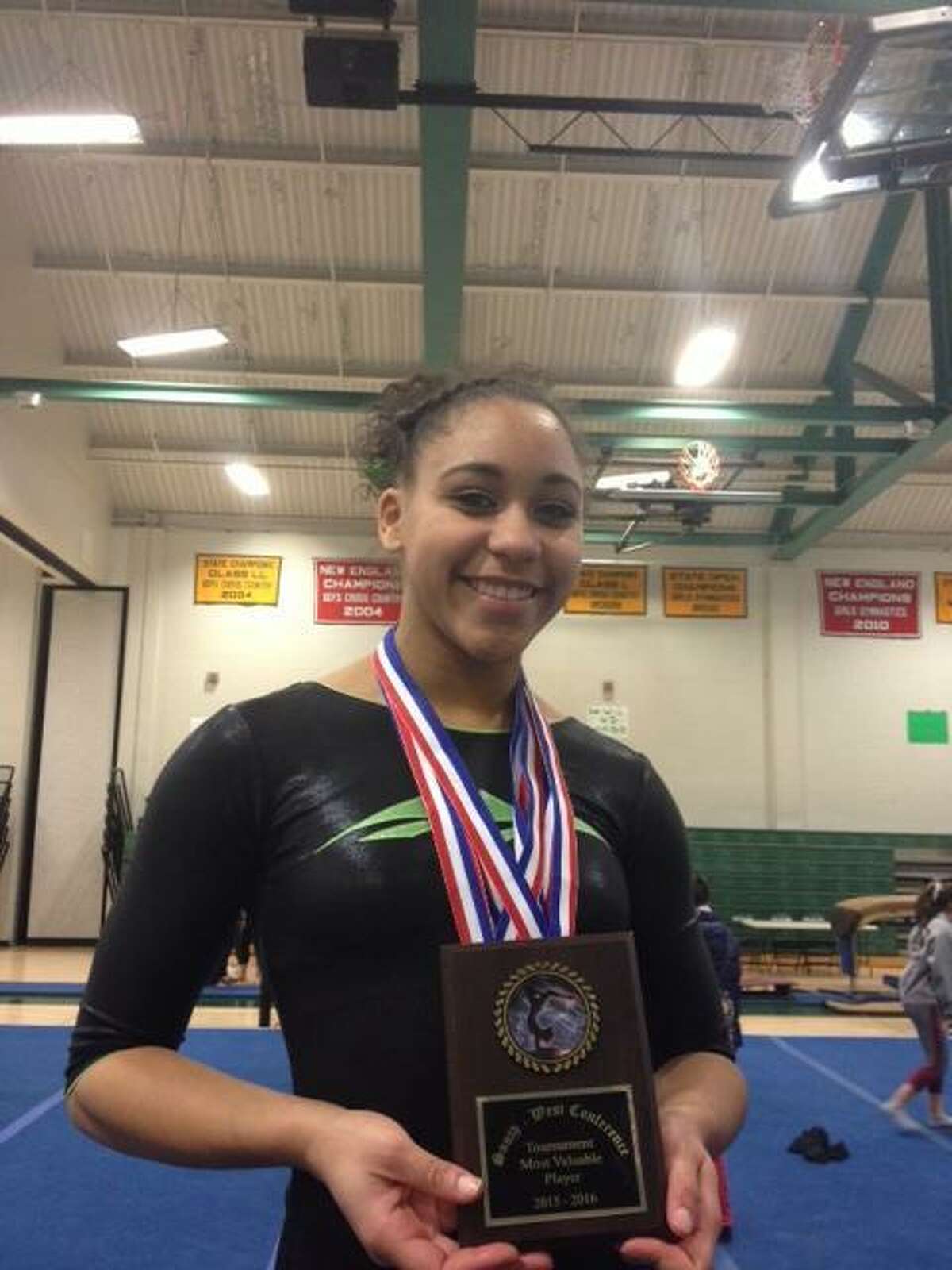 New Milford sophomore Mikayla Dumas won the all-around (36.10), the vault (9.30), the bars (9.00) and the floor (9.00) to help the Green Wave win their third straight SWC gymnastics championship on Thursday.