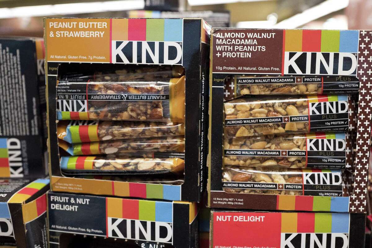 Kind snack bars are displayed in a New York supermarket. Kind CEO’s move to create a nonprofit dedicated to revealing and countering the food industry’s influence on public health underscores the division between Big Food companies and newer players that market themselves as wholesome alternatives aligned with public health.