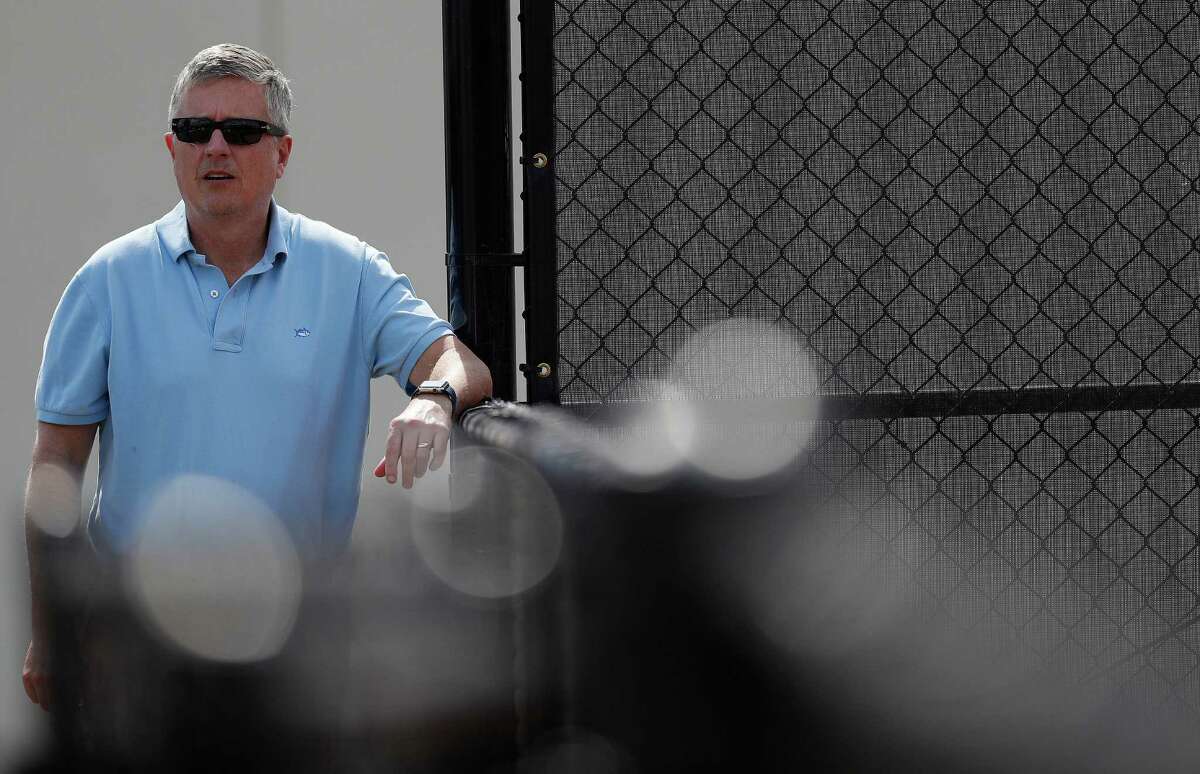 Houston Astros general manager Jeff Luhnow observes as the Astros pitchers and catchers held their first workout of spring training at The Ballpark of the Palm Beaches, in West Palm Beach, Florida, Tuesday, February 14, 2017.
