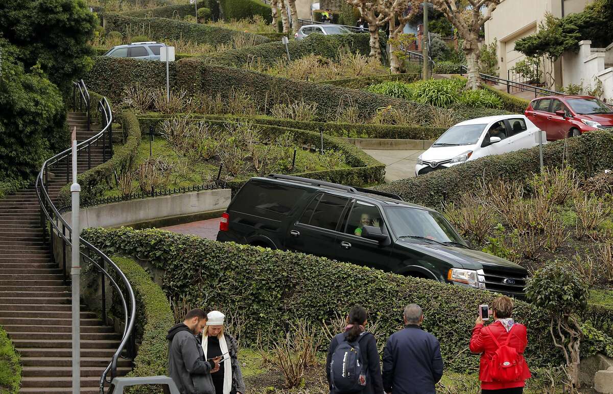 Vehicles twist their way down Lombard St. on Wednesday Feb. 15, 2017, in San Francisco, Ca. San Francisco Supervisor Mark Farrell wants to charge a toll to drive down the famed roadway.