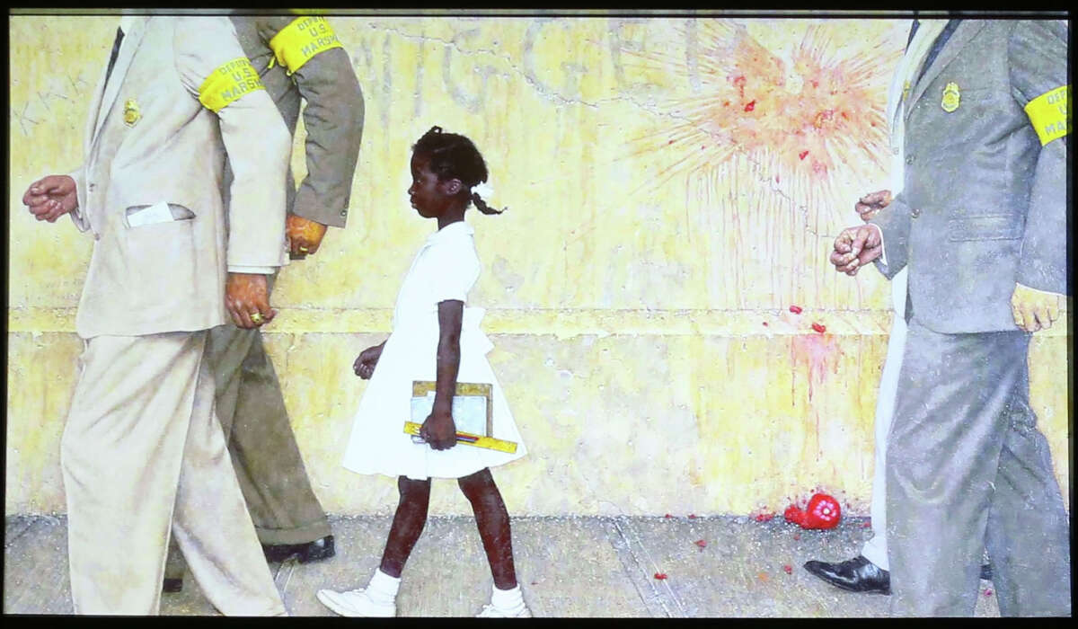 Norman Rockwell's "The Problem We All Live With" depicts 6-year-old civil rights hero Ruby Bridges as she entered an all-white school in 1960. (Photo by Frederick M. Brown/Getty Images)