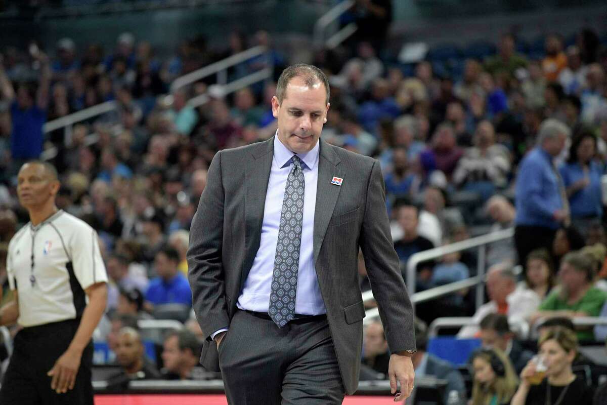 Orlando Magic head coach Frank Vogel walks onto the court during a timeout in the first half of an NBA basketball game against the San Antonio Spurs in Orlando, Fla., Wednesday, Feb. 15, 2017. (AP Photo/Phelan M. Ebenhack)