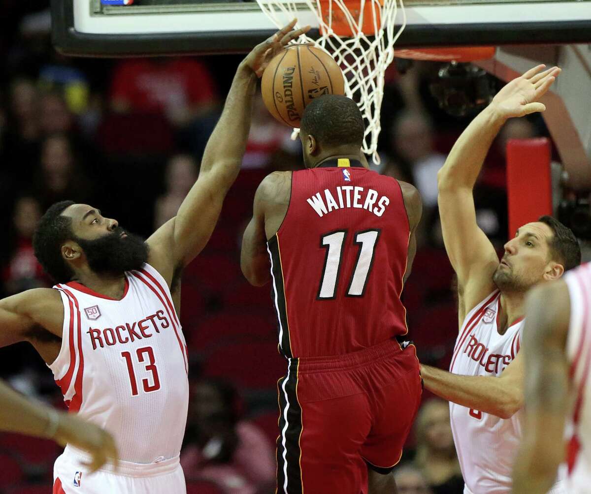 James Harden stops a drive by Dion Waiters (11), but the Heat guard didn't meet much resistance as he had 23 points, nine rebounds and seven assists.