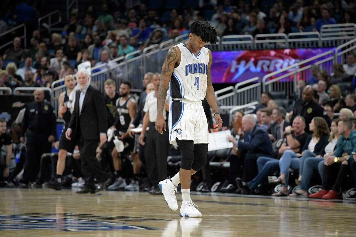 Orlando Magic guard Elfrid Payton (4) walks back to the bench after a timeout was called during the first half of an NBA basketball game against the San Antonio Spurs in Orlando, Fla., Wednesday, Feb. 15, 2017. (AP Photo/Phelan M. Ebenhack)