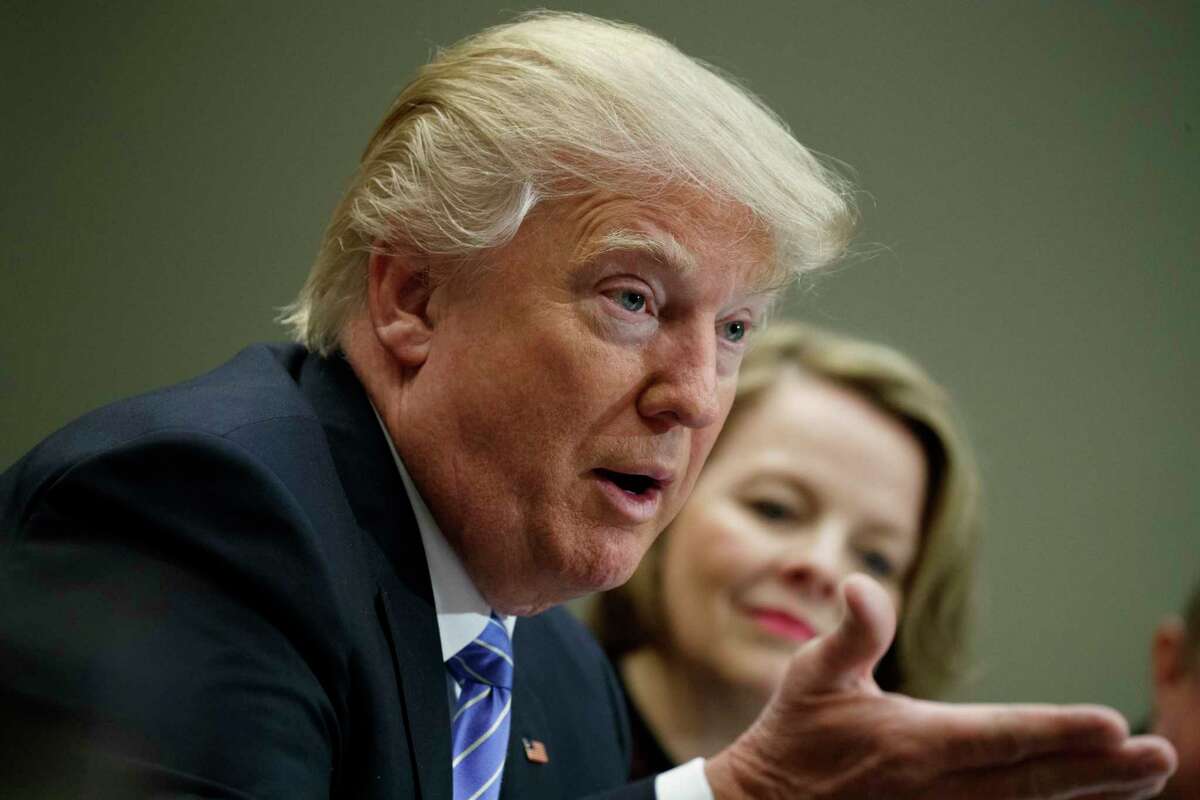 Jo-Ann Craft Stores CEO Jill Soltau listens at right as President Donald Trump speaks during a meeting with retail industry leaders in the Roosevelt Room of the White House in Washington, Wednesday, Feb. 15, 2017. (AP Photo/Evan Vucci)