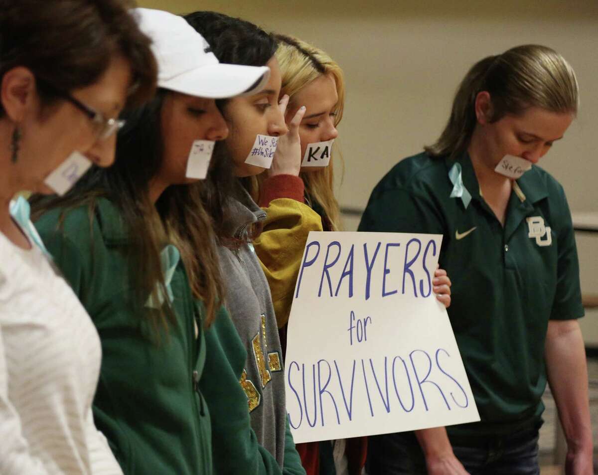 Current and former Baylor students hold a rally warning of sexually assaults on and off campus, Friday, June 3, 2016, in Waco, Texas. Calling the rally Un-silence the Survivors, they read an open letter to the administration about improvements on how the school should handle sexual assaults after observing a moment of silence. (Rod Aydelotte/Waco Tribune Herald, via AP)
