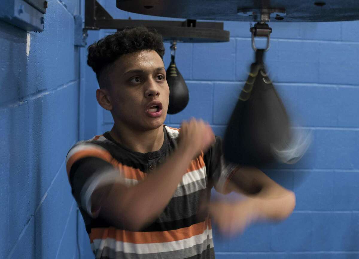 Tommy Santana, a member of the San Fernando Boxing Club, works out on a punching bag at Lincoln Community Center on Feb. 14, 2017, in San Antonio.