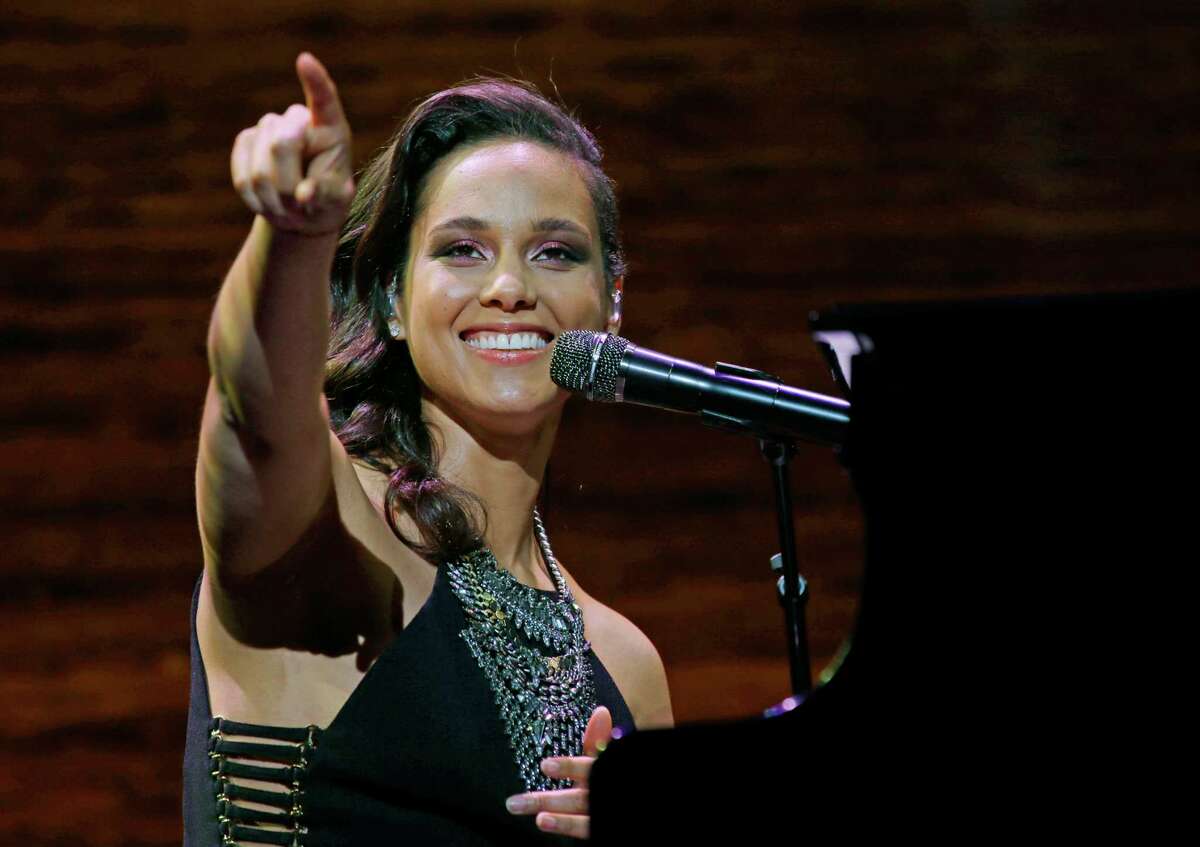 FILE - In this March 23, 2016 file photo, singer Alicia Keys performs at the coffee company's annual shareholders meeting in Seattle. Keys will debut new music at the upcoming UEFA Champions League Final in Milan, Italy on May 28. (AP Photo/Ted S. Warren, File)