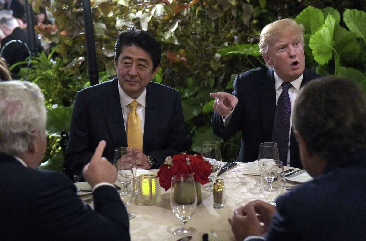 President Donald Trump dines with Japanese Prime Minister Shinzo Abe at his Mar-a-Lago resort in Palm Beach, Fla. A reader wonders whether the president threatened national security by meeting with the Japanese leader in public.