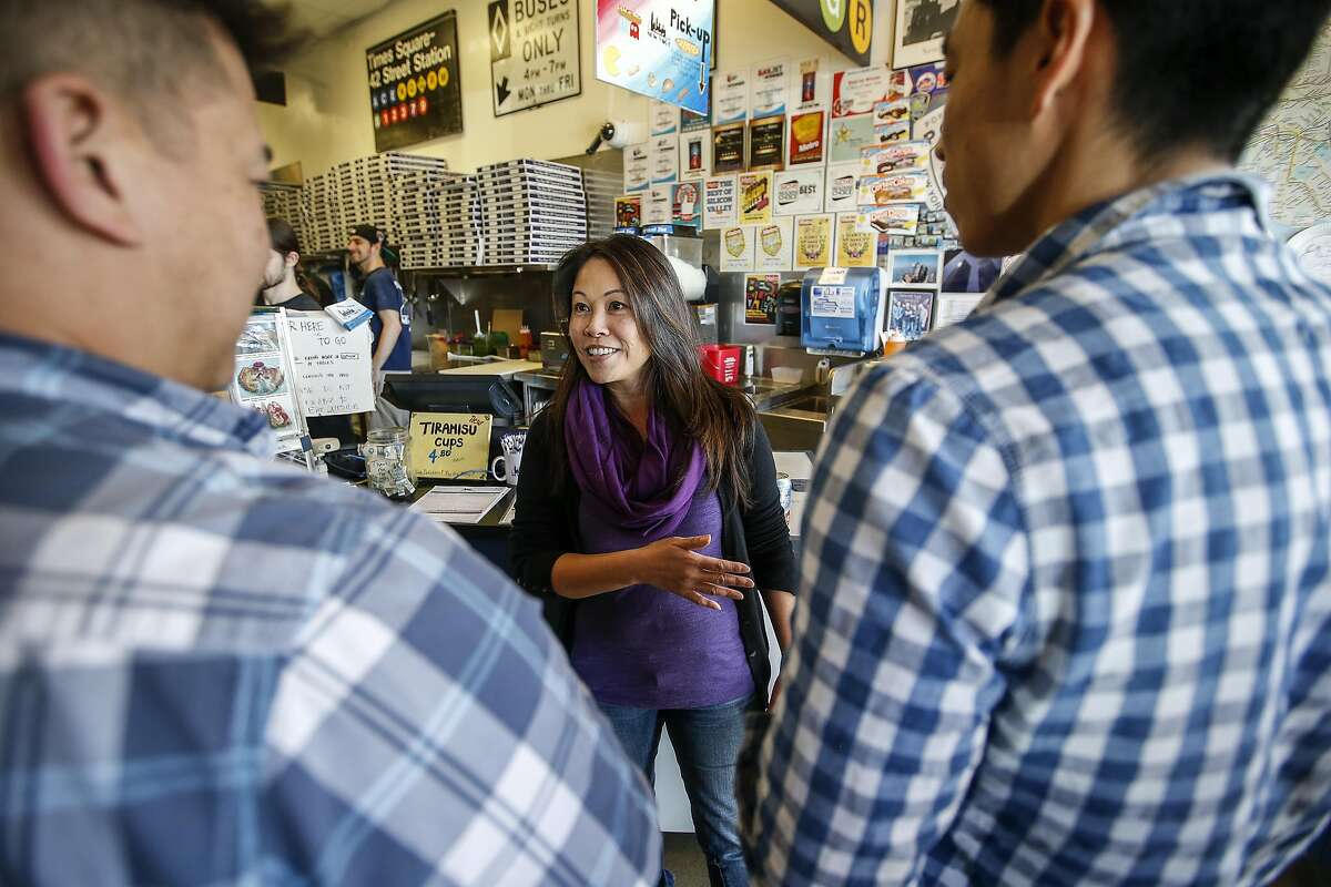 Marguerite Lee co-owner of A Slice of New York talks with customers during lunch time on Thursday, Feb. 16, 2017 in San Jose, California. A Slice of New York, a New York-style pizzeria is in the process of transitioning from a traditional owner structure to a cooperative that will create a democratic governance system with 10 employees becoming co-owners of the business.
