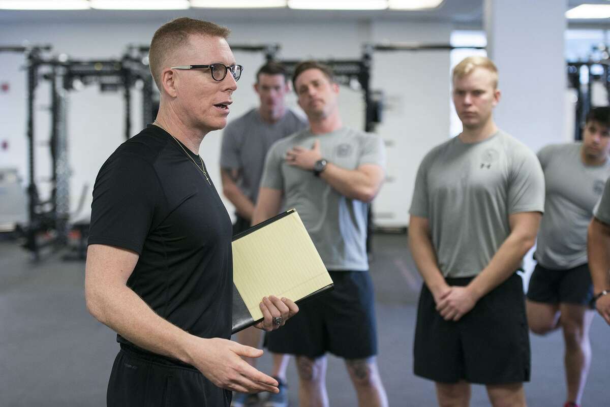 Tim “Red” Wakeham, Michigan State University strength and conditioning coach, speaks to Tactical Air Control Party instructors about kinesiology as he helped to refine their training program Feb. 1 at Joint Base San Antonio-Lackland Medina Annex.