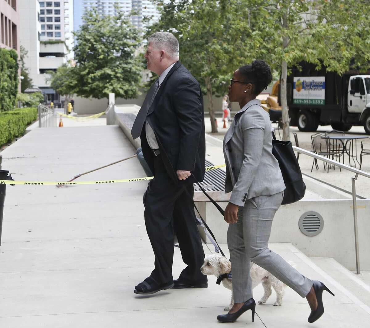 Rear Adm. Robert Gilbeau enters the federal courthouse in San Diego on Thursday, June 9, 2016. Gilbeau pleaded guilty Thursday to lying to federal authorities investigating a $34 million fraud scheme involving a Malaysian contractor known as "Fat Leonard." (AP Photo/Lenny Ignelzi)