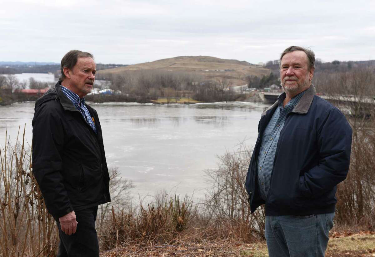 George Harris, left, and Frank Hartley, right, stand on a hilltop overlooking the Mohawk River and Colonie Landfill on Friday, Jan. 20, 2017, in Colonie, N.Y. The neighbors live directly across the river from the dump. (Will Waldron/Times Union)