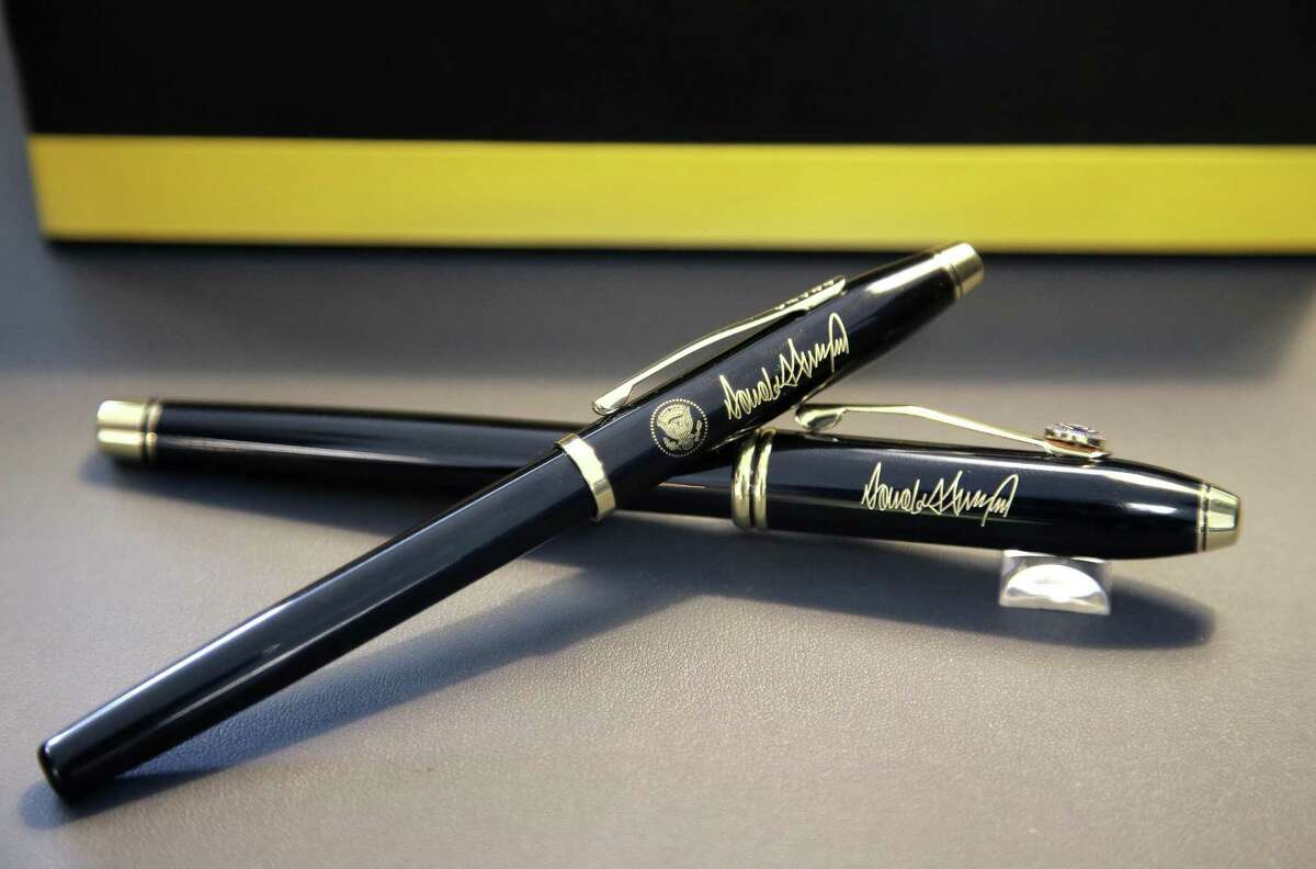A.T. Cross Co. custom-made pens designed for President Donald Trump, featuring his signature and presidential seal, are displayed at the Cross Co. store in Providence, R.I.
