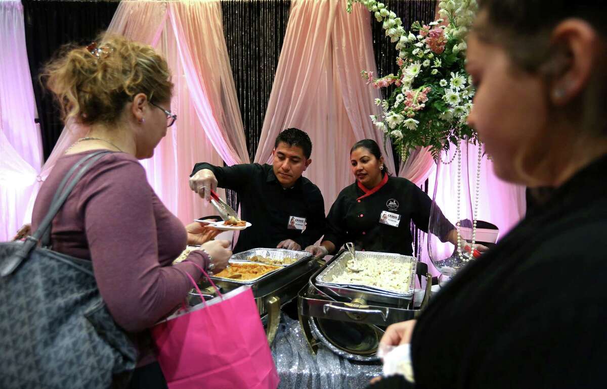 Servers from Los Chefs Hermanos Catering offer samples to potential quinceañera customers at an expo in Houston earlier this year. The city ranked No. 1 among U.S. cities for cultivating minority-owned businesses in a recent survey.