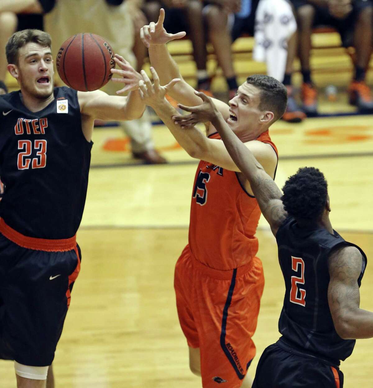 UTSA’s Lucas O’Brien (center) grabs for a rebound between UTEP’s Hooper Vint (left) and Omega Harris during first half action on Jan. 16, 2016 at the Convocation Center.