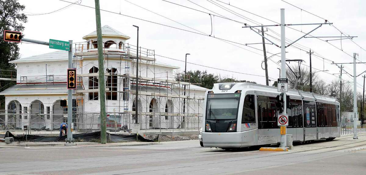 A Metro train makes it's way past new construction along Harrisburg on Jan. 9. Metro has plans for more light rail in Houston, but no current funding for projects.