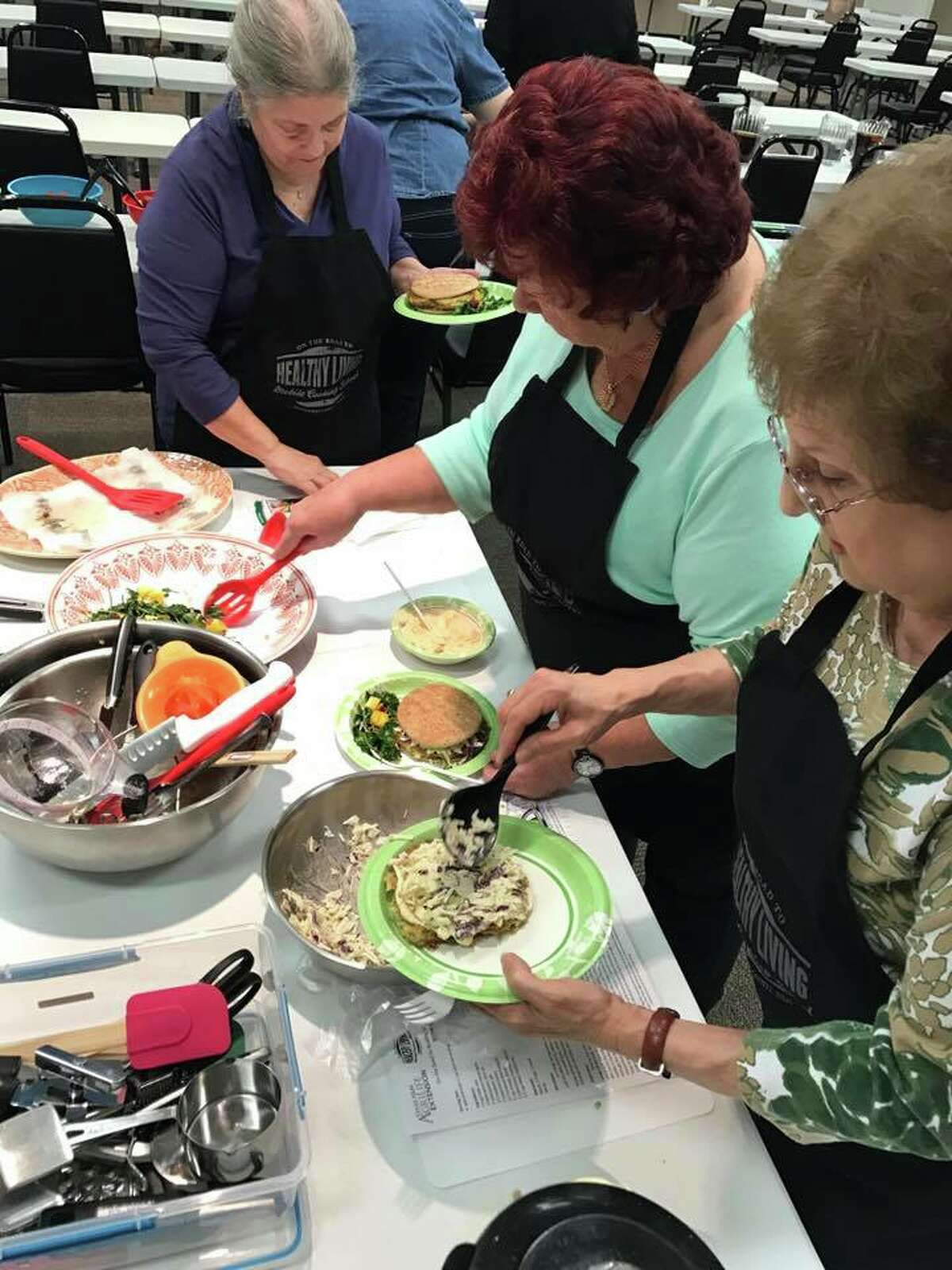 A local retired teachers group participates in a Mobile Cooking School class.