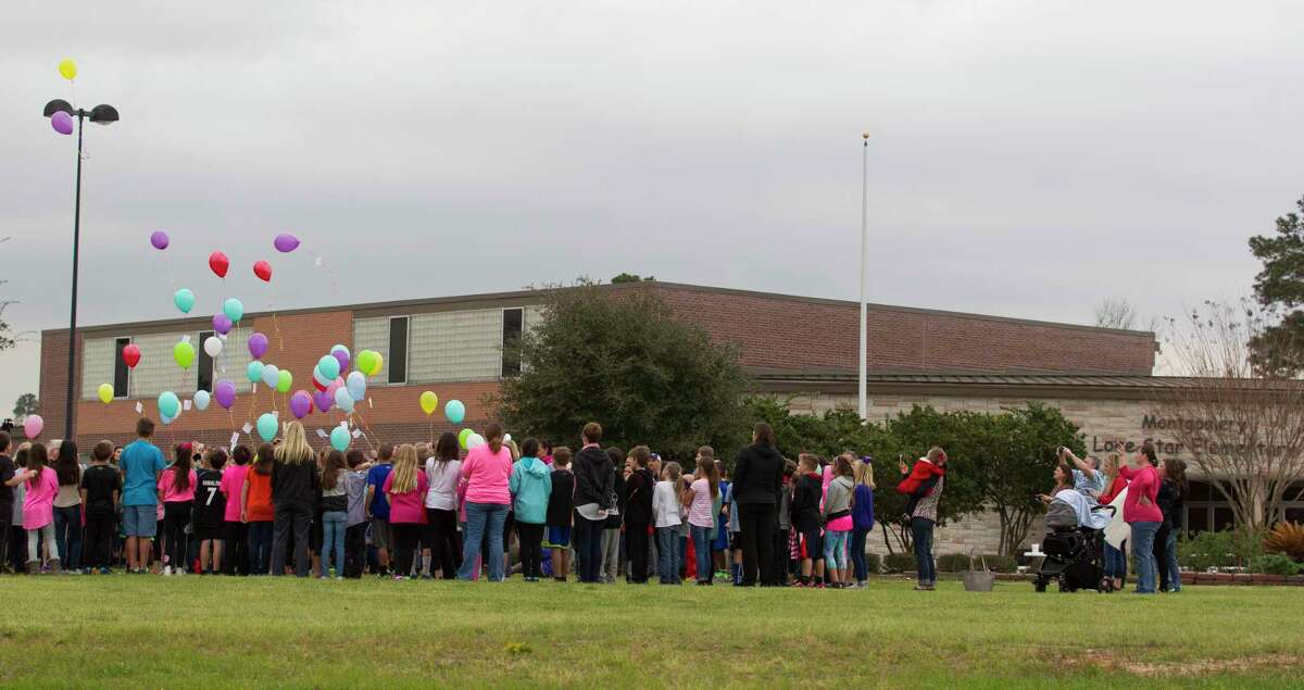 Students, teachers and visitors take part in a balloon release in honor of fourth-grade teacher Jenny Runnels at Lone Star Elementary Friday, Feb. 17, 2017, in Montgomery. Runnels died after being hospitalized from a head-on collision at FM 2854 near Honea Egypt Road Wednesday afternoon that left her and the other driver Floyd Nelms, Jr., 31, dead. Runnels' 10-year-old daughter is in stable condition at Texas Children's Hospital in Houston, according to school officials.